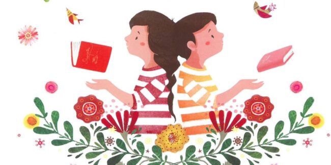 dzieci siedzą na trawie i czytają książki