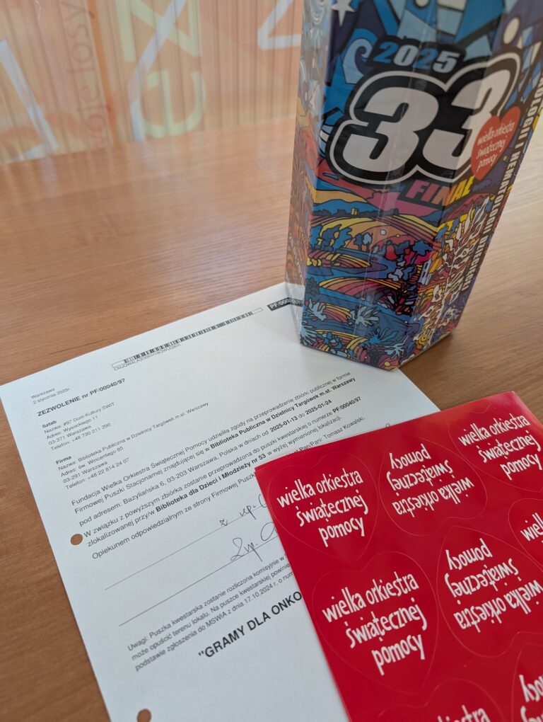 puszka i dokument wielkiej orkiestry świątecznej pomocy